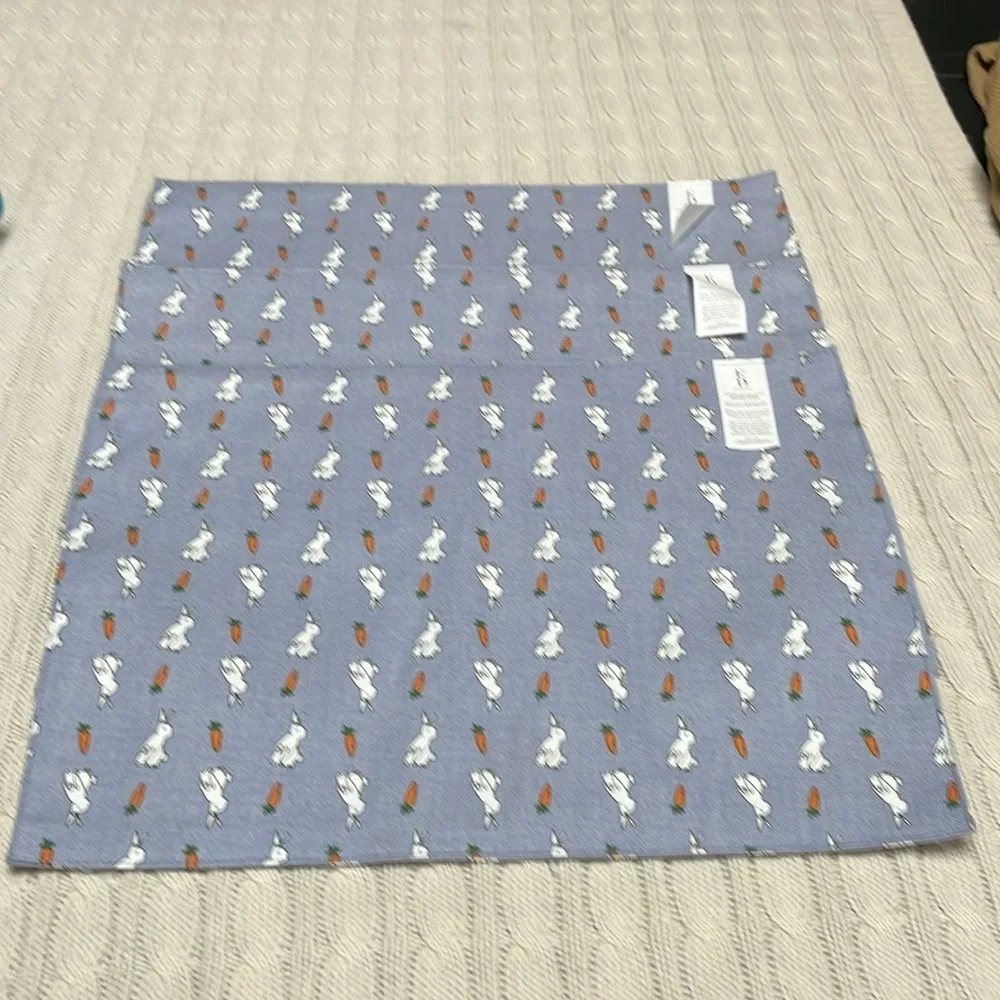 3 NWT Ellen Degeneres bunny/carrot table placemats. 18” x 13” blue background.